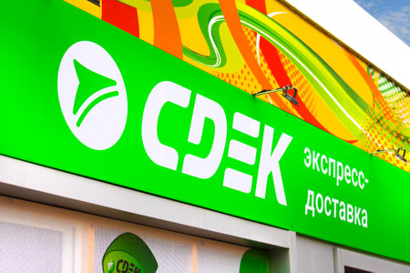 Krasnoyarsk, Russia - May 2 2022: logo of SDEK or CDEK on facade building. SDEK is an express...