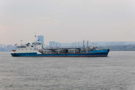 Krasnoyarsk, Russia - May 9, 2022: Auxiliary vessel 'Sborshchik-3', equipped to collect oil products from the surface of the water. Motor ship with detachable tanks of project 795.のeditorial素材