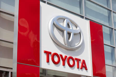 Krasnoyarsk, Russia - June 19, 2022: Close-up Toyota brand logo on wall building.のeditorial素材