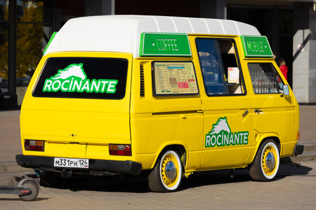 Krasnoyarsk, Russia - 23 September, 2022: Mobile coffee shop in yellow cozy Volkswagen Transporter T3 minibus on city street.のeditorial素材