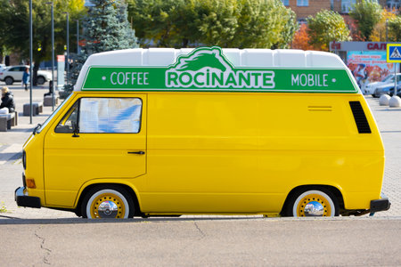 Krasnoyarsk, Russia - 23 September, 2022: Mobile coffee shop in yellow Volkswagen Transporter T3 minibus on city street. Food minibus truck. street food business.のeditorial素材