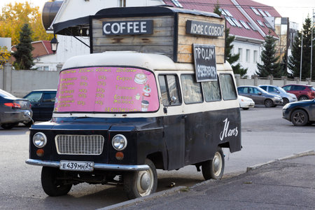 Krasnoyarsk, Russia - 24 September, 2022: Mobile coffee shop in brown Nysa 522 van on city street.のeditorial素材