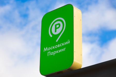Moscow, Russia - 13 November, 2022: Green signboard Moscow Parking against the blue sky. Moscow Parking project administer the parking space on the territory of capital, both paid and free parkingのeditorial素材