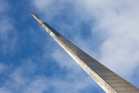 Moscow, Russia - 13 November, 2022: Space rocket against blue sky background. Top of Monument to the Conquerors of Space in VDNKh, Moscow. Space exploration symbol.のeditorial素材