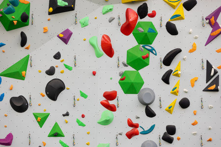 Moscow, Russia - 13 November, 2022: Outdoors wall with colorful climbing holds on VEB Arena or Arena CSKA. Climbing wall backgroundのeditorial素材