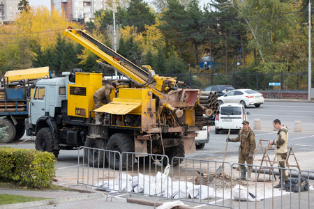 Krasnoyarsk, Russia - September 22, 2022: truck based Drilling or peeling machine on city street. urban construction siteのeditorial素材
