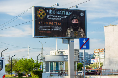 Krasnoyarsk, Russia - 24 June, 2023: outdoor advertising banner Wagner Private Military Company or PMC Wagner on city street. Leader staged a military mutiny with the capture of the Rostov-on-Don cityのeditorial素材