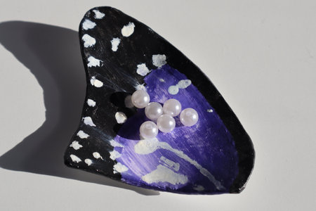 Jewelry made of natural stone with pearls on a white backgroundの写真素材