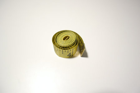 Measuring tape on a white background. The concept of diet.