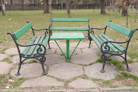 Benches in the park on a sunny spring day.の写真素材