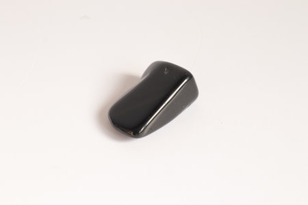 Black hematite isolated on white background, closeup of the photo.の写真素材