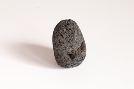 Lava Stone isolated on a white background. Macro photo, selective focus.の写真素材