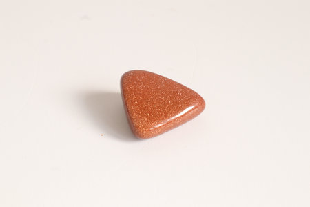 Colored chalcedony gemstone on a white background.の写真素材