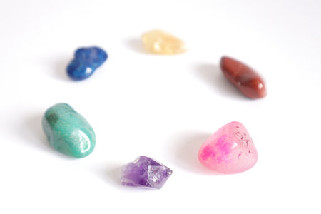 Colorful stones on a white background. Macro. Selective focus.