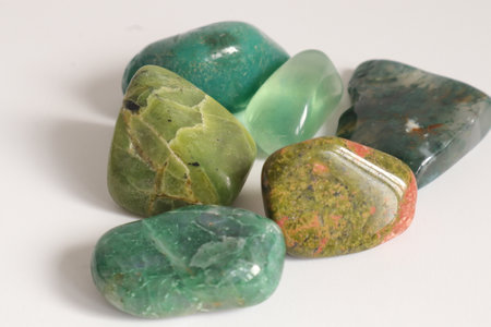 multicolored semiprecious stones on white background closeupの写真素材