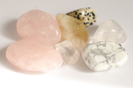 precious stones of different colors on a white background close-upの写真素材