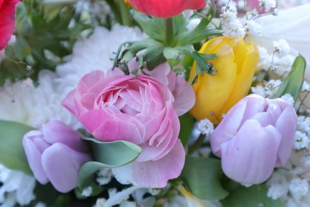 Colorful tulips and peonies in a bridal bouquet