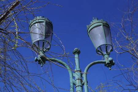 Lamppost on blue sky background, closeup of photoの写真素材