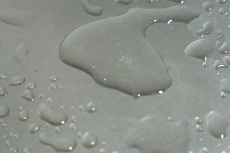 Water drops on a gray background. Close up. Abstract background.の写真素材