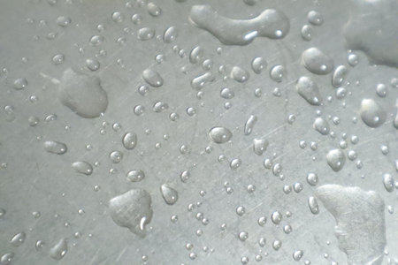 water drops on a stainless steel surface, close-up, macroの写真素材