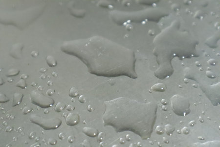 Water drops on a white background. Water drops on a glass surface.の写真素材