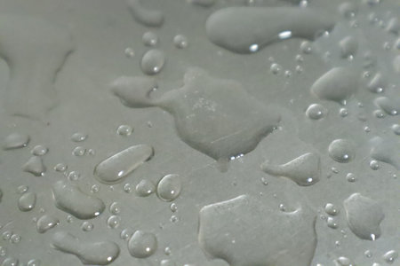Water drops on a metal surface. Water drops on a metal surface.の写真素材