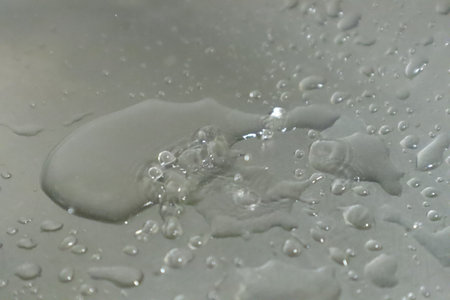 Water drops on a white background, close-up of photo.の写真素材