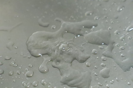 Water drops on a white background. Shallow depth of field.の写真素材