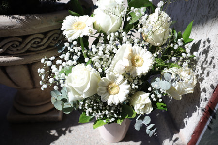 Bridal bouquet of white roses in a vase.の写真素材