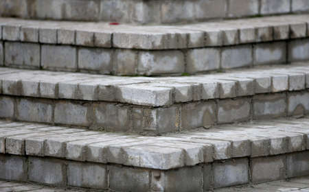 Ash brick paved steps in a park, abstract background and texture.