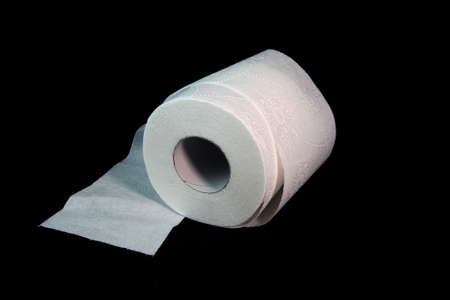 Three toilet paper rolls on a black backgroundの写真素材