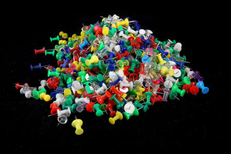 several assorted colors of plastic push pins
