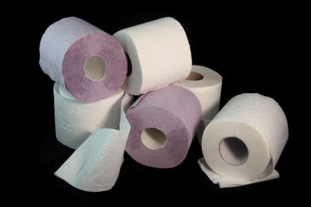 Three toilet paper rolls on a black backgroundの写真素材