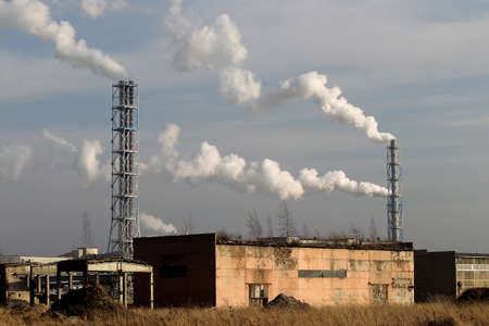 Factory with smoking chimneys in cloudy, Lithuania, Kedainiaiの写真素材