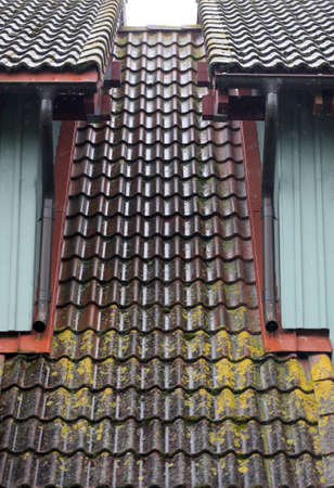 Old tile roof over rain Lithuania