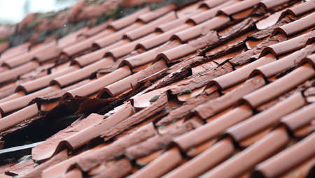 Old tile roof over rain Lithuaniaの写真素材