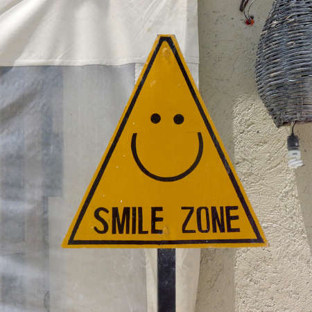 Yellow triangle sign, smile zone. Mexicoの写真素材