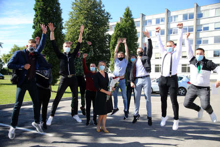 Pupils and teachers wearing masks protect themselves from coronavirus when they return to school....