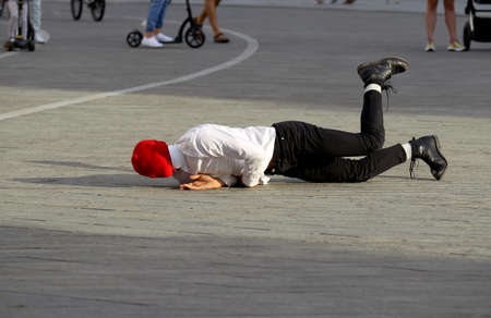 A solo dancer on the street. Protest dance, in the colors of the historical flag of Belarus, support...