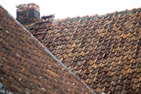 Red tiled roofs of Kuldiga old town buildings. Latviaの写真素材