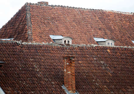 Red tiled roofs of Kuldiga old town buildings. Latviaの写真素材