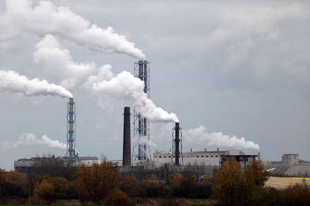 Factory with smoking chimneys in cloudy, Lithuania, Kedainiai