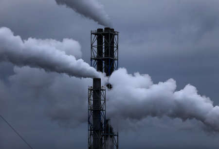 Factory with smoking chimneys in cloudy, Lithuania, Kedainiai