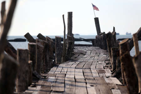 Old wood bridge to sea