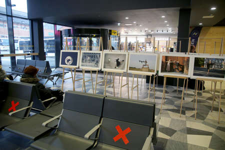When galleries and exhibition halls were closed during the pandemic, photojournalist Algimantas Barzdzius organized a photography exhibition in the waiting area of Kaunas bus station.のeditorial素材