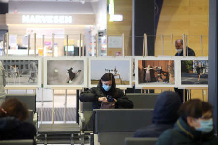 When galleries and exhibition halls were closed during the pandemic, photojournalist Algimantas Barzdzius organized a photography exhibition in the waiting area of Kaunas bus station.のeditorial素材