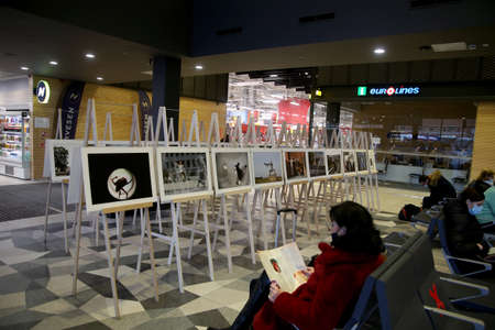 When galleries and exhibition halls were closed during the pandemic, photojournalist Algimantas Barzdzius organized a photography exhibition in the waiting area of Kaunas bus station.のeditorial素材