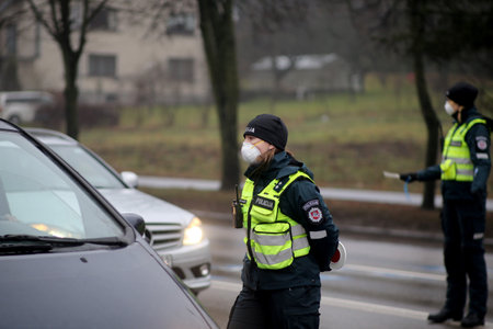 In Lithuania, the police have begun to restrict movement between municipalities, and the police check residents' documents when entering cities. Pandemic outbreak. 18 12 2020のeditorial素材