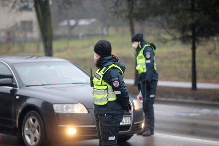 In Lithuania, the police have begun to restrict movement between municipalities, and the police check residents' documents when entering cities. Pandemic outbreak. 18 12 2020のeditorial素材