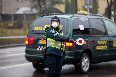 In Lithuania, the police have begun to restrict movement between municipalities, and the police check residents' documents when entering cities. Pandemic outbreak. 18 12 2020のeditorial素材